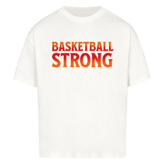 Weißes Oversized Basketball T-Shirt mit dem Print „BASKETBALL STRONG“ in einer ikonischen, rot-orangen Retro-Schriftart. Aus 100% Baumwolle.