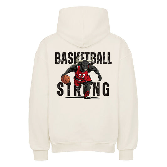 Rückansicht eines cremefarbenen Oversized-Hoodies mit 'Basketball Strong' Print, der einen Minotaurus im roten Trikot #21 beim Dribbling zeigt. Premium Baumwolle.