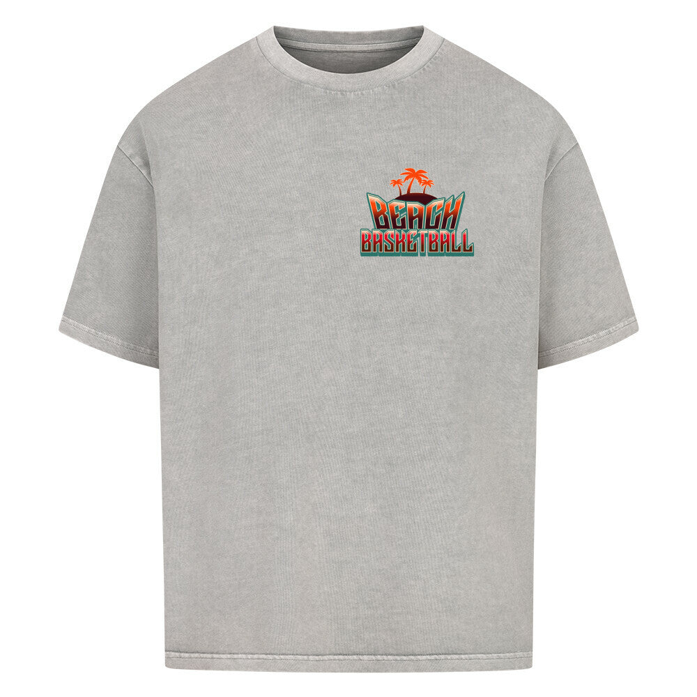 Kleiner "Beach Basketball" Retro-Print mit Palmen in Orange und Türkis auf der linken Brust eines washed  grey Oversized T-Shirts. 100% Baumwolle
