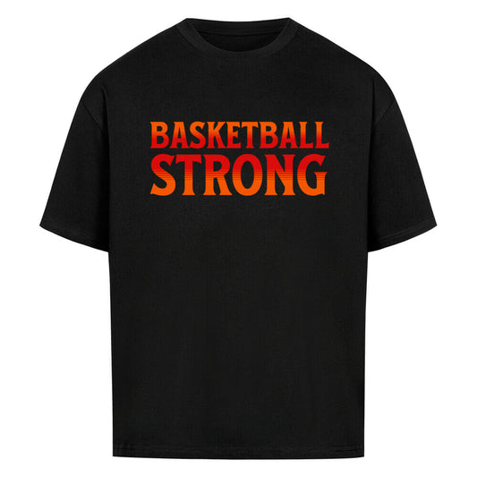 Schwarzes Oversized Basketball T-Shirt mit dem Print „BASKETBALL STRONG“ in einer ikonischen, rot-orangen Retro-Schriftart. Aus 100% Baumwolle.