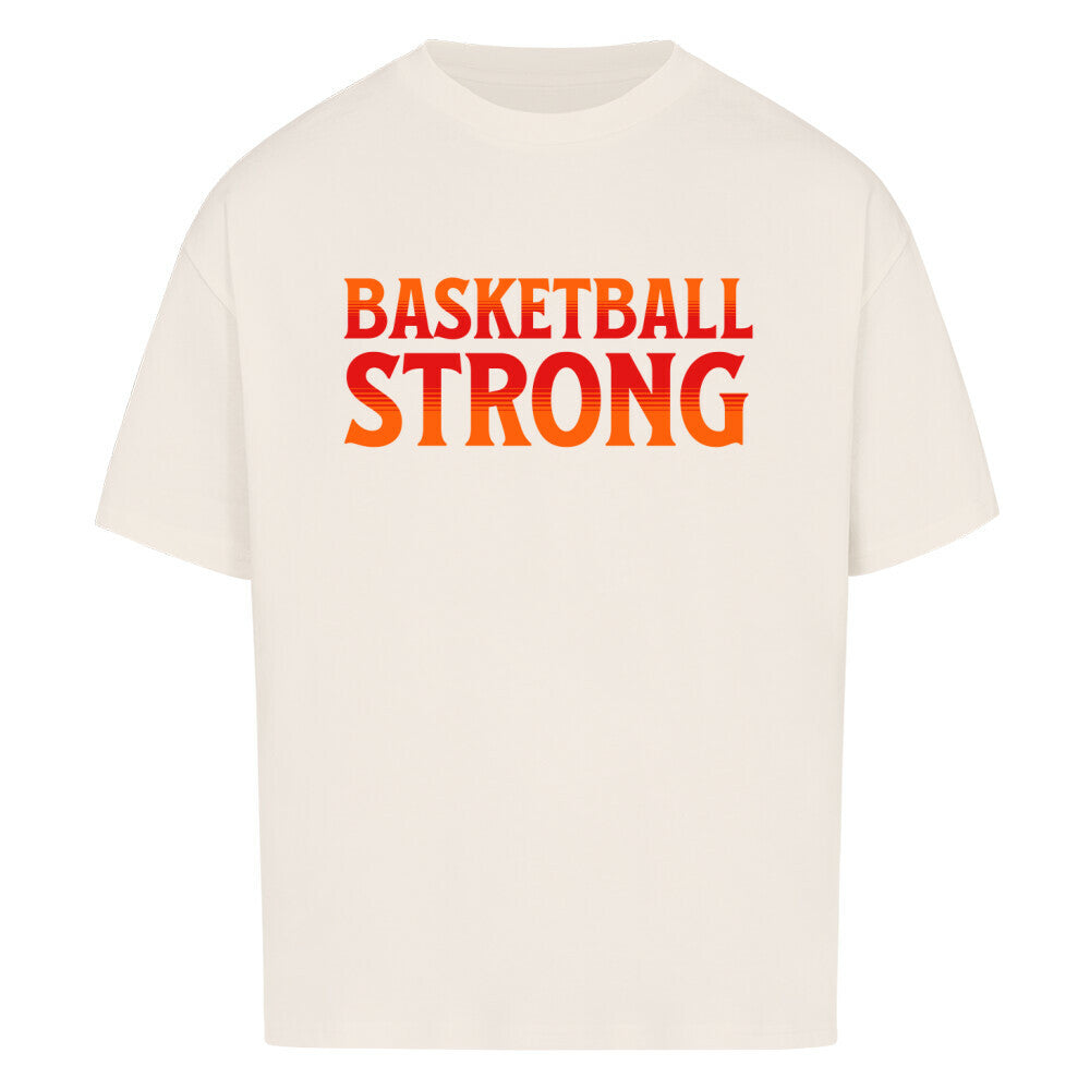 Natural Raw Oversized Basketball T-Shirt mit dem Print „BASKETBALL STRONG“ in einer ikonischen, rot-orangen Retro-Schriftart. Aus 100% Baumwolle.