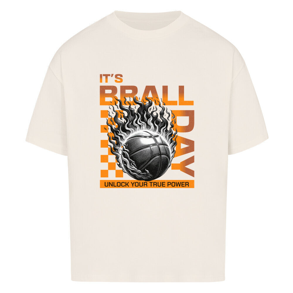 Natural Raw Oversized T-Shirt mit einem Print eines brennenden Basketballs (Ball on Fire) und dem orangefarbenen Text „IT'S BBALL DAY“ und „UNLOCK YOUR TRUE POWER“. 100% Baumwolle.