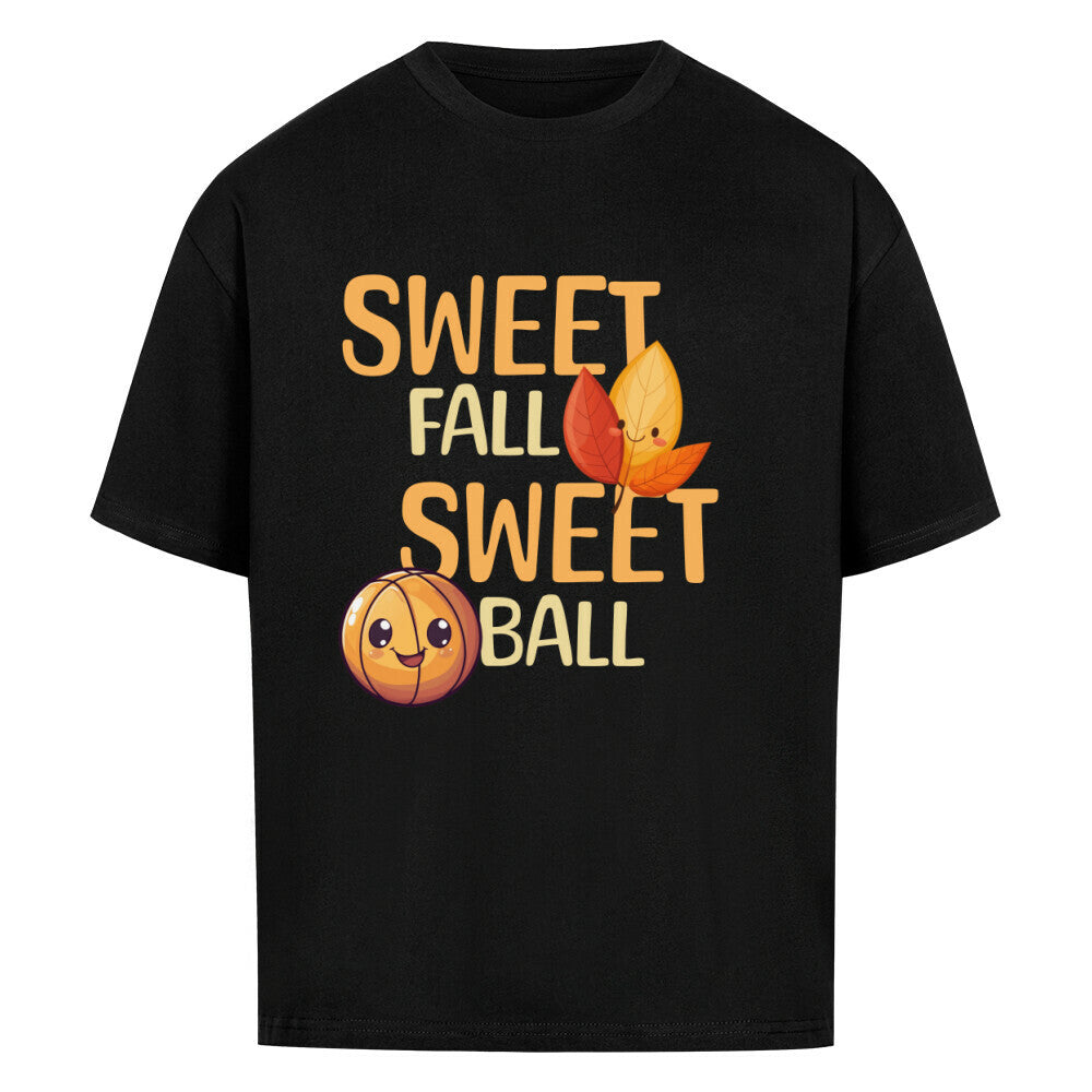 Schwares Oversized T-Shirt mit orangefarbenem Print „SWEET FALL SWEET BALL“, verziert mit einem niedlichen lächelnden Basketball und zwei lachenden Herbstblättern – 100% Baumwolle.