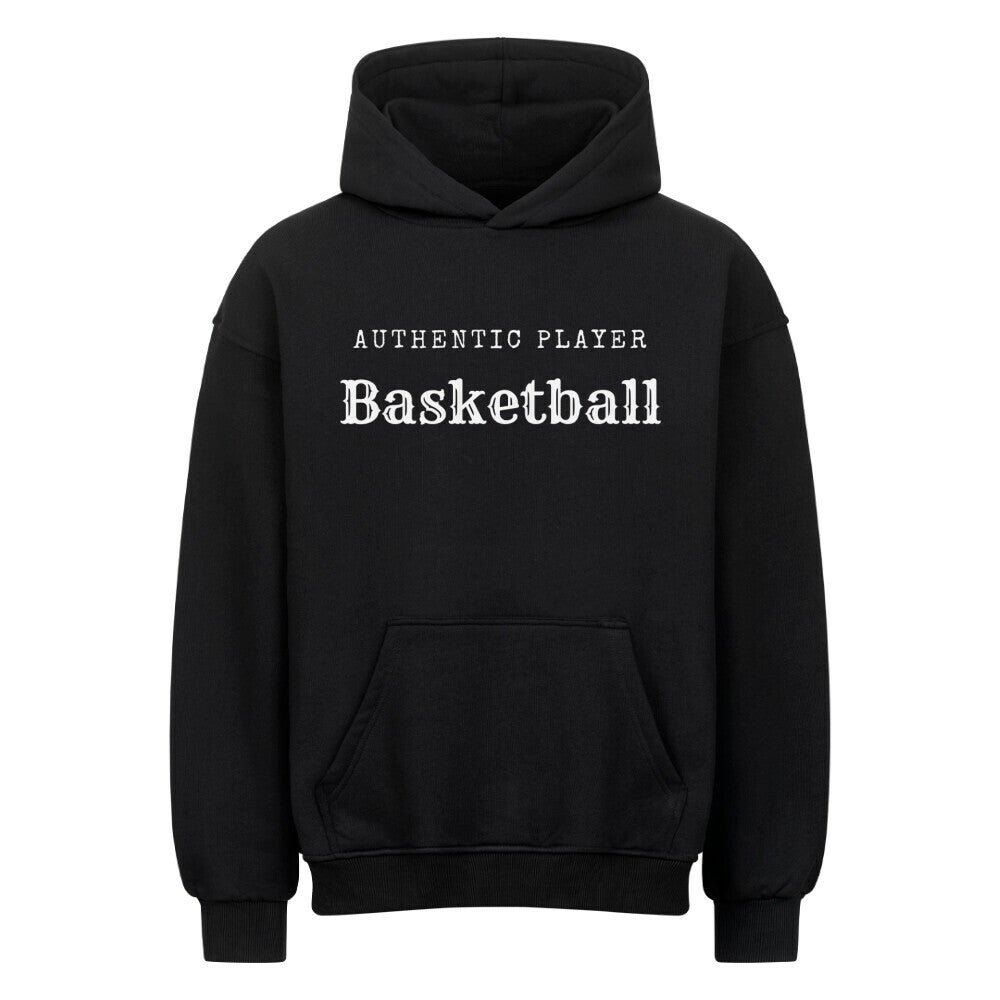 Vorderansicht eines schwarzen Oversized-Hoodies mit dem minimalistischen weißen Aufdruck 'Authentic Player Basketball' auf der Brust. Premium Baumwolle.