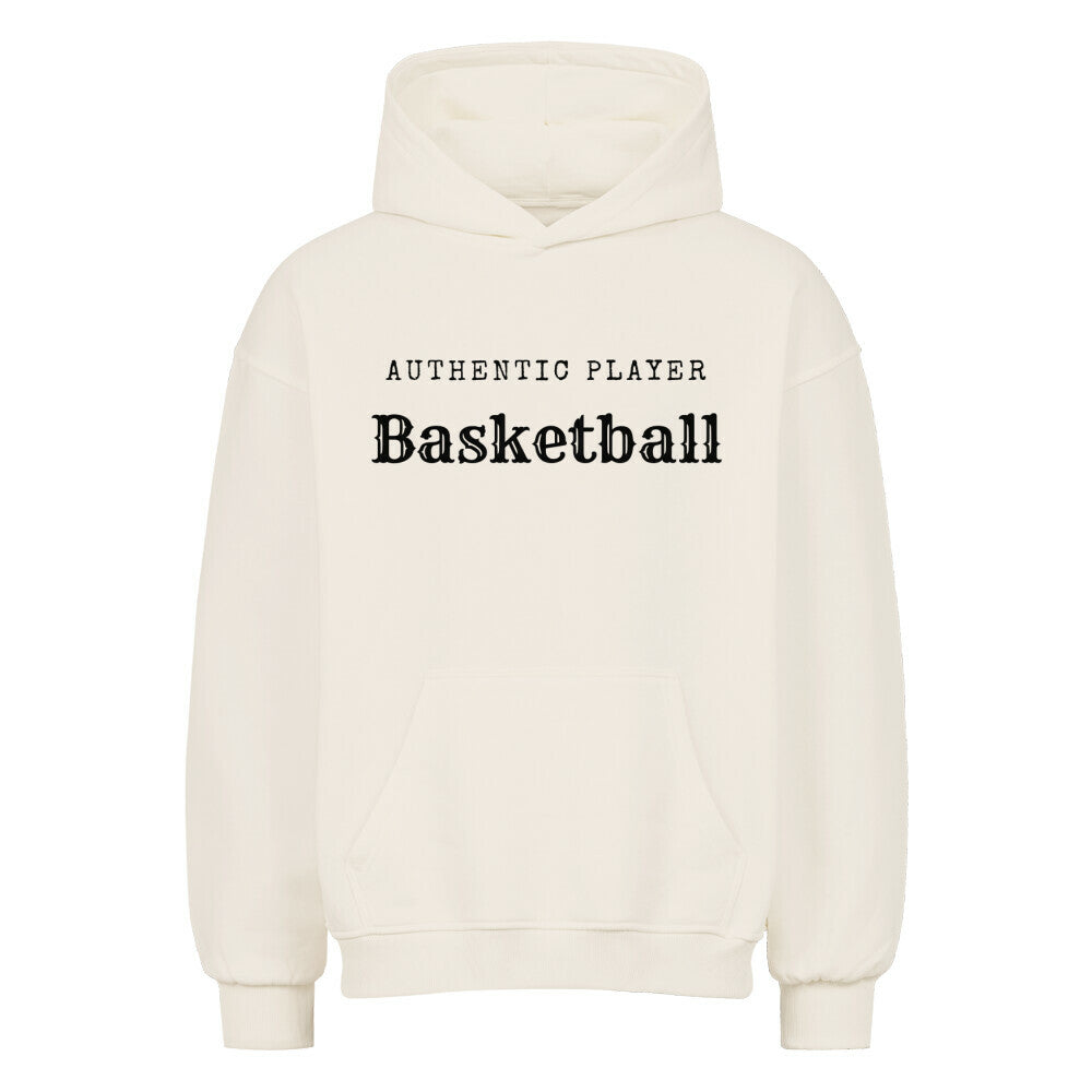 Vorderansicht eines Natural Raws Oversized-Hoodies mit dem minimalistischen schwarzen Aufdruck 'Authentic Player Basketball' auf der Brust. Premium Baumwolle.