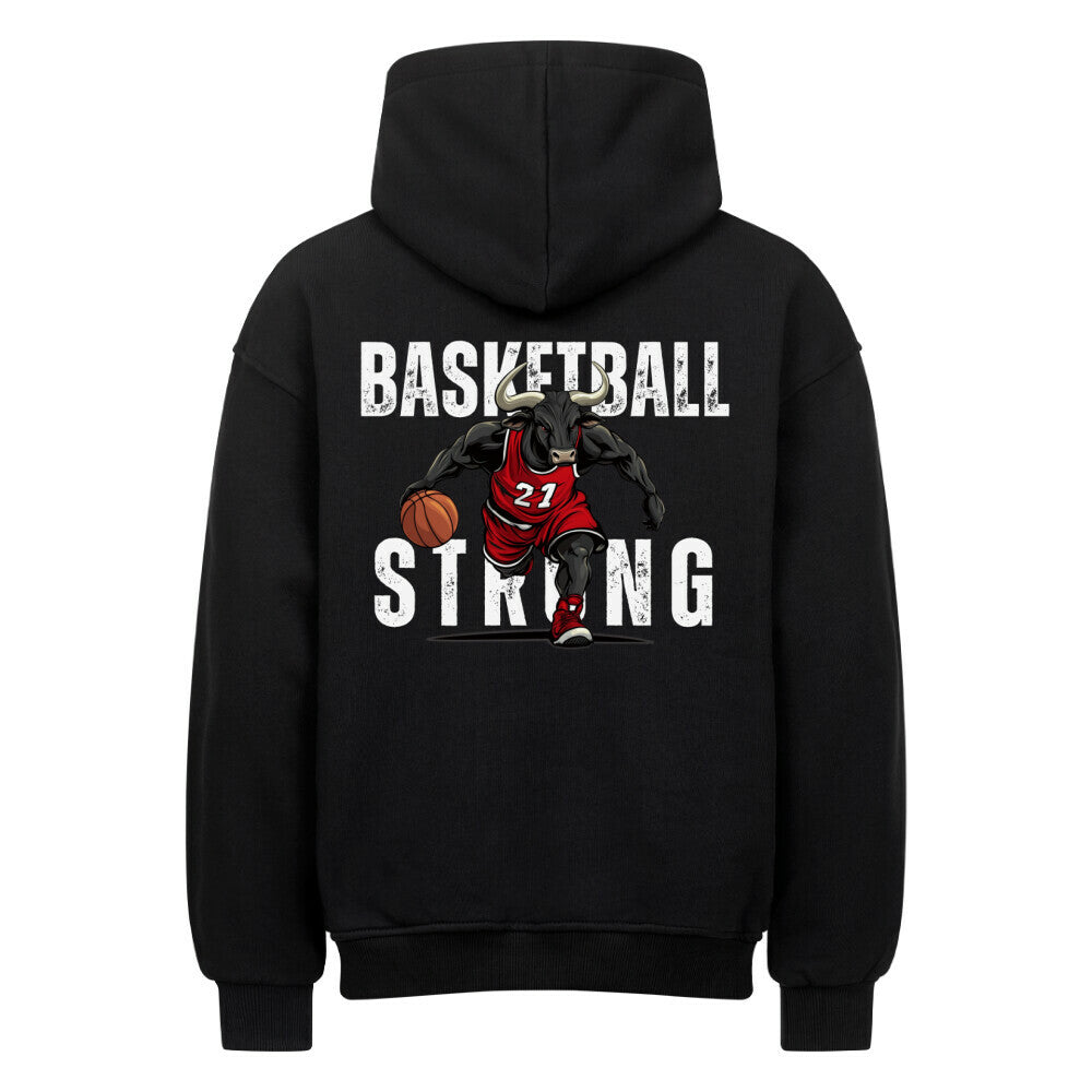 Rückansicht eines schwarzen Oversized-Hoodies mit 'Basketball Strong' Print, der einen Minotaurus im roten Trikot #21 beim Dribbling zeigt. Premium Baumwolle.