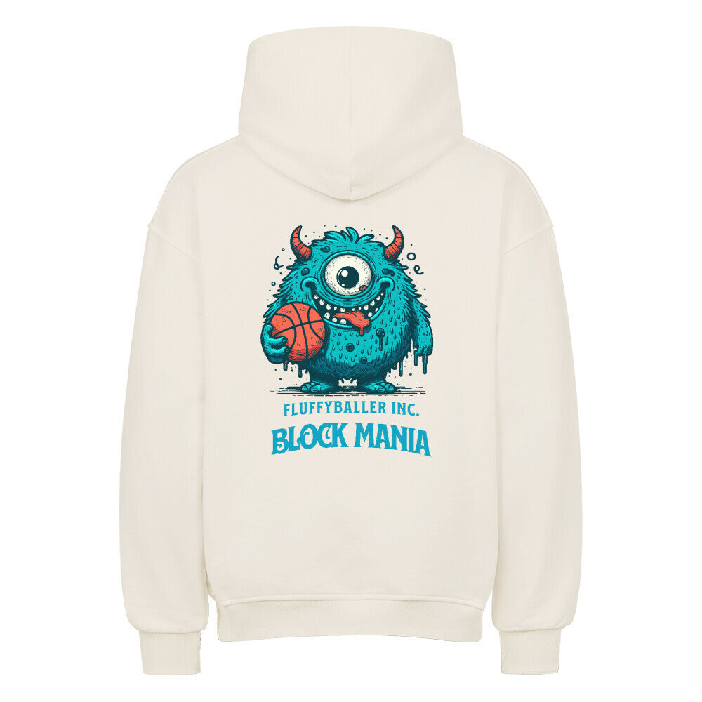 Rückansicht eines cremefarbenen Oversized-Hoodies mit 'Block Mania' Print, der ein türkises, einäugiges Monster zeigt, das einen Basketball hält.